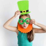 The lovely girl in a mask of a leprechaun for a St. Patrick's Da
