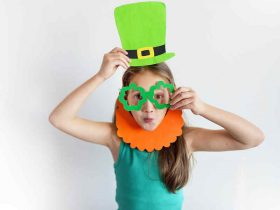 The lovely girl in a mask of a leprechaun for a St. Patrick's Da